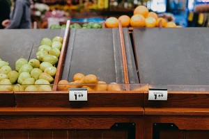 empty fresh fruit aisle at grocery store 1350672768