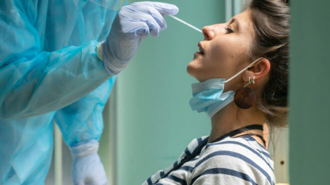 Healthcare,Worker,With,Protective,Equipment,Performs,Coronavirus,Swab,On,Caucasian