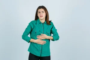 beautiful young lady green shirt feeling stomach pain looking unwell front view 176474 66269
