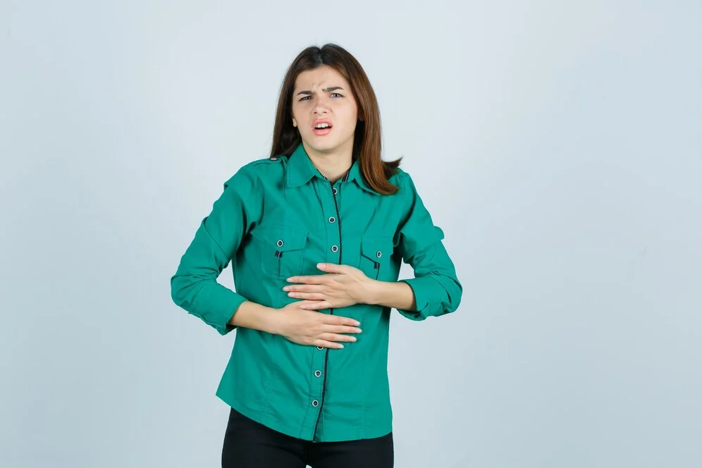 beautiful young lady green shirt feeling stomach pain looking unwell front view 176474 66269