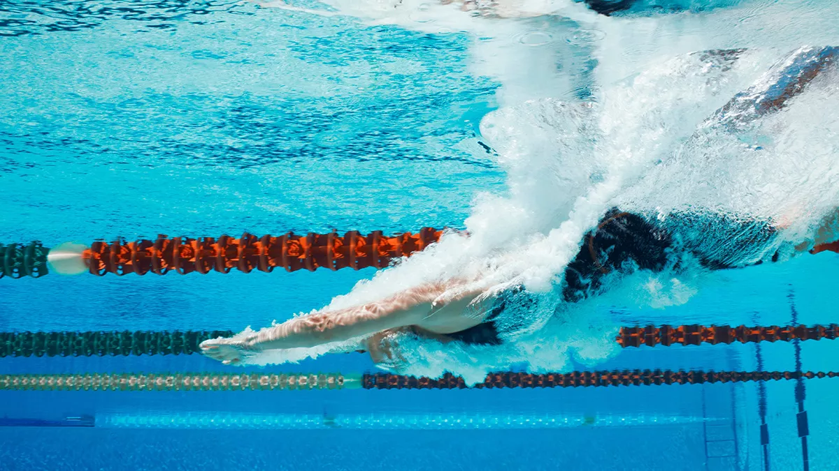 swimming shutterstock 2328320549